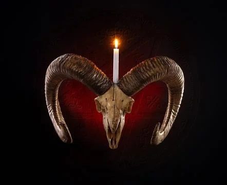 Devil pentagram with a skull of ram with a lighted candle and evil symbols Stock Photos