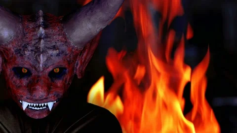 Devil on the side against the background of fire Stock Footage 220005421