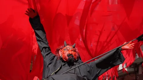 Devil with a trident on a throne on a red background 動画素材 114326305