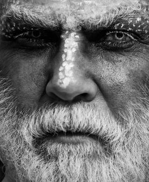 Devil vampire man. Halloween bearded man with blood make-up. Halloween man with Stock Photos