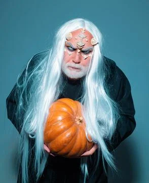 Devil in wicked witch hat. Bloody skin for Halloween. Halloween man. The crazy Stock Photos