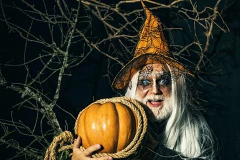 Devil in wicked witch hat. Demon for Halloween party. Halloween demon. Bearded 스톡 사진