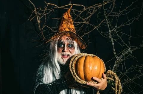 Devil in wicked witch hat. Demon for Halloween party. Halloween demon. Bearded Foto stock