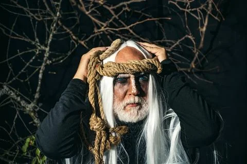 Devil in wicked witch hat. Demon for Halloween party. Halloween demon. Bearded Foto stock