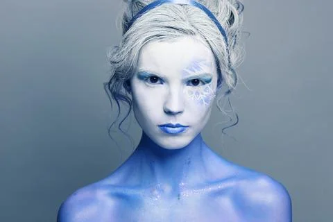 Devil woman with creative makeup on gray background, fashion portrait Foto stock