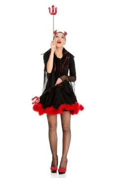 Devil woman pointing up with trident. Foto stock