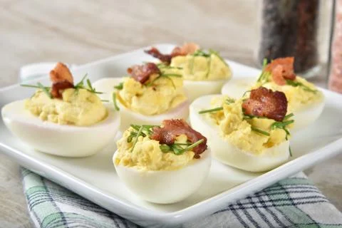 Deviled egg with bacon Stock Photos