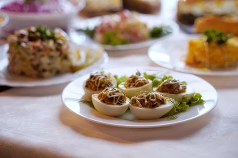 Deviled eggs aka stuffed eggs. Traditional Ukrainian food on the holiday table. Stock Photos