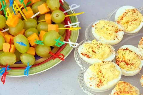 Deviled eggs and grapes appetizer Stock Photos