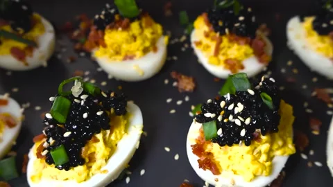 Deviled Eggs With Black Caviar and Bacon Appetizer 動画素材 332620339