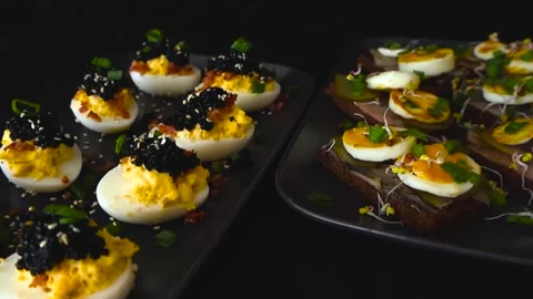 Deviled Eggs with Black Caviar and Sandwiches for Catering Stock Footage 333851289