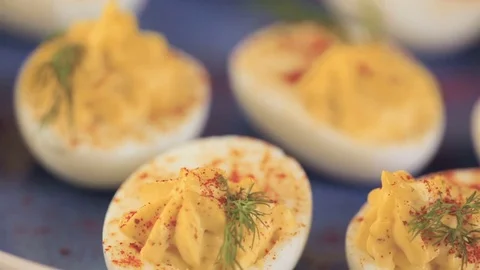 Deviled eggs garnished with fresh dill. 스톡 동영상 69723902