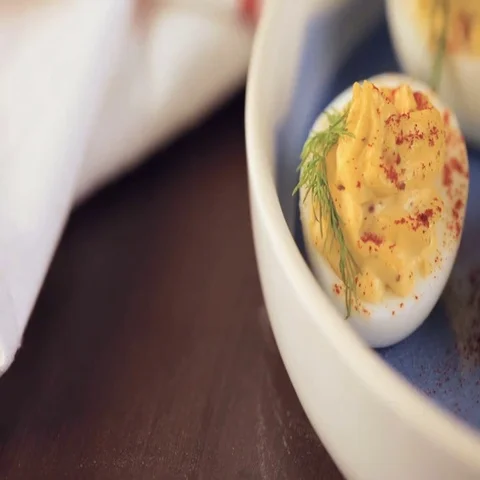 Deviled eggs garnished with fresh dill. Video stock 69724268