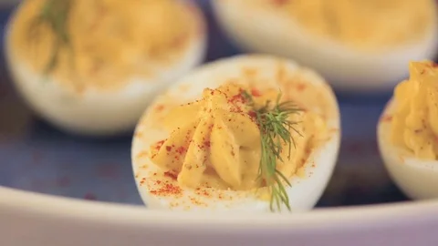 Deviled eggs garnished with fresh dill. Video stock 69724649