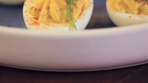 Deviled eggs garnished with fresh dill. Video stock 69724791