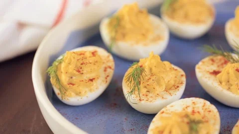Deviled eggs garnished with fresh dill. Video stock 69724931
