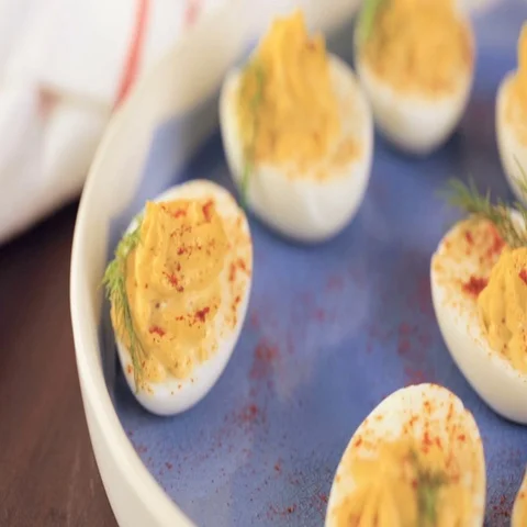 Deviled eggs garnished with fresh dill. Video stock 69725045