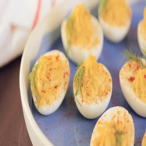 Deviled eggs garnished with fresh dill. Video stock 69725059