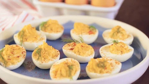 Deviled eggs garnished with fresh dill. Video stock 69725063