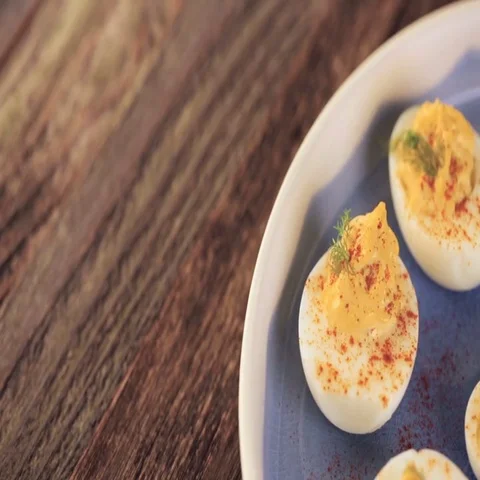 Deviled eggs garnished with fresh dill. Video stock 69725365