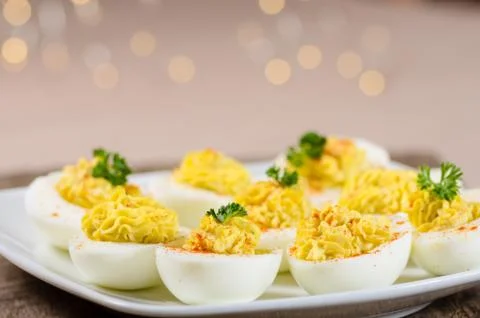Deviled eggs garnished with parsley and paprika Fotos Stock