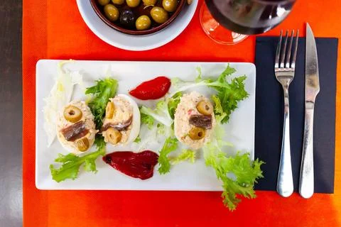 Deviled eggs with olives. Stuffed egg halves Stock Photos