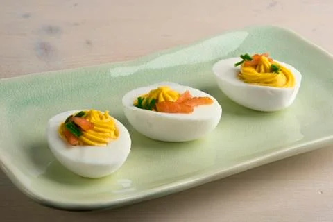 Deviled eggs with smoked salmon and chives Stock Photos