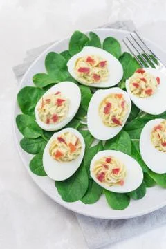 Deviled eggs stuffed with avocado, egg yolk and mayonnaise filling Photos