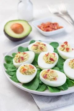 Deviled eggs stuffed with avocado, egg yolk and mayonnaise filling Stock Photos