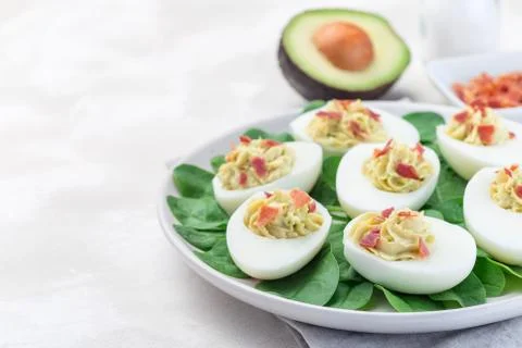 Deviled eggs stuffed with avocado, egg yolk and mayonnaise filling Stock Photos