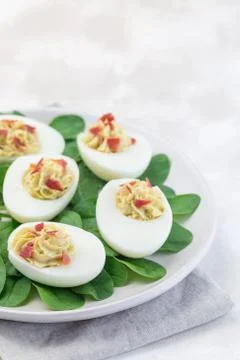Deviled eggs stuffed with avocado, egg yolk and mayonnaise filling Stock Photos
