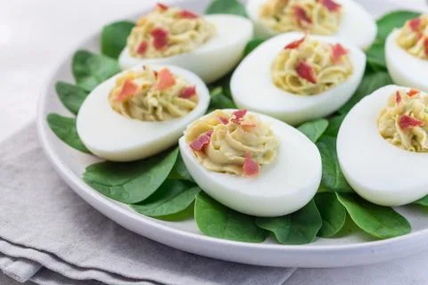Deviled eggs stuffed with avocado, egg yolk and mayonnaise filling Stock Photos
