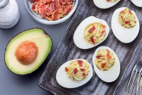 Deviled eggs stuffed with avocado, egg yolk and mayonnaise filling Stock Photos