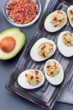 Deviled eggs stuffed with avocado, egg yolk and mayonnaise filling Stock Photos