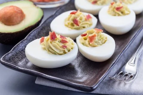 Deviled eggs stuffed with avocado, egg yolk and mayonnaise filling 스톡 사진