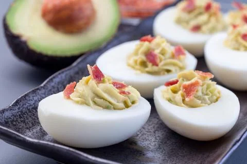 Deviled eggs stuffed with avocado, egg yolk and mayonnaise filling Stock Photos