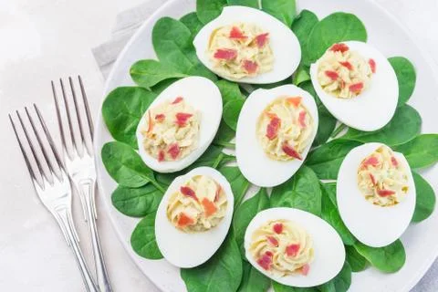 Deviled eggs stuffed with avocado, egg yolk and mayonnaise filling Stock Photos