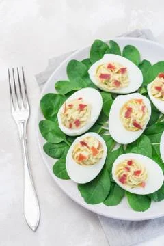 Deviled eggs stuffed with avocado, egg yolk and mayonnaise filling Foto stock