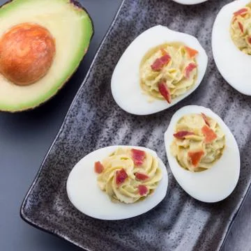 Deviled eggs stuffed with avocado, egg yolk and mayonnaise filling Stock Photos