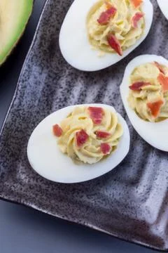Deviled eggs stuffed with avocado, egg yolk and mayonnaise filling 写真素材