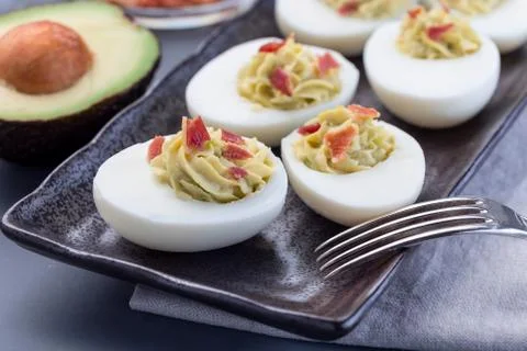 Deviled eggs stuffed with avocado, egg yolk and mayonnaise filling 스톡 사진