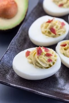 Deviled eggs stuffed with avocado, egg yolk and mayonnaise filling Stock Photos