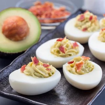 Deviled eggs stuffed with avocado, egg yolk and mayonnaise filling 스톡 사진