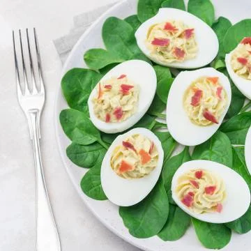 Deviled eggs stuffed with avocado, egg yolk and mayonnaise filling Stock Photos