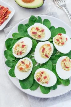 Deviled eggs stuffed with avocado, egg yolk and mayonnaise filling Stock Photos