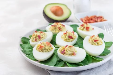 Deviled eggs stuffed with avocado, egg yolk and mayonnaise filling 스톡 사진