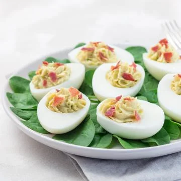 Deviled eggs stuffed with avocado, egg yolk and mayonnaise filling 스톡 사진