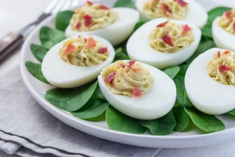 Deviled eggs stuffed with avocado, egg yolk and mayonnaise filling Stock Photos