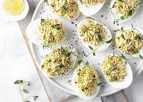Deviled eggs on a white plate Stock Photos