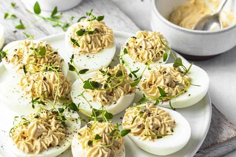 Deviled eggs on a white plate Stock Photos